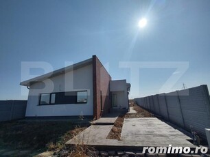 Casa nouă racordată la rețeaua de gaze, cu un teren de 385 mp, zona Damila