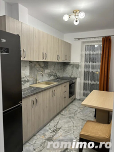 Apartament cu 2 camere, balcon, parcare subterana, etaj intermediar, bloc nou