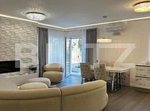 Apartament 2 camere, ultrafinisat, mobilat si utilta, 40 mp gradina si parcare