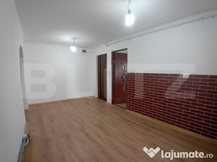 Apartament renovat cu 2 camere decomandate și garaj în Dum